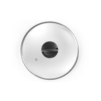 Ibili Lasikansi 20 cm ylhäältä kuvattuna - kirkas lasikansi höyryaukolla ja ergonomisella kahvalla, sopii 20 cm astioihin.