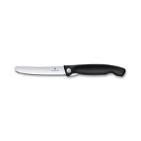 Victorinox Swiss Classic Taittuva Eväsveitsi retkelle, avattuna suoraksi, ergonominen musta kahva ja terävä sahalaitainen terä.